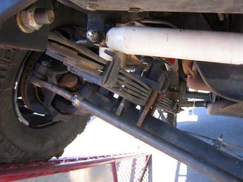 1994 Ford Bronco - This image shows the complex undercarriage of a vehicle, focusing on its suspension and steering systems.