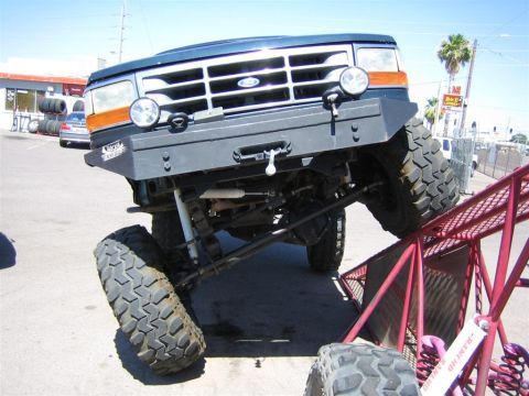 1994 Ford Bronco - This 1992 Ford Bronco features a custom bumper and oversized tires, demonstrating its off-road capabilities.