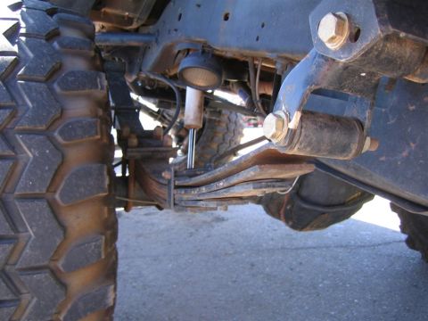 1994 Ford Bronco - This image shows the underside of a vehicle, focusing on its heavy-duty tire and suspension components.