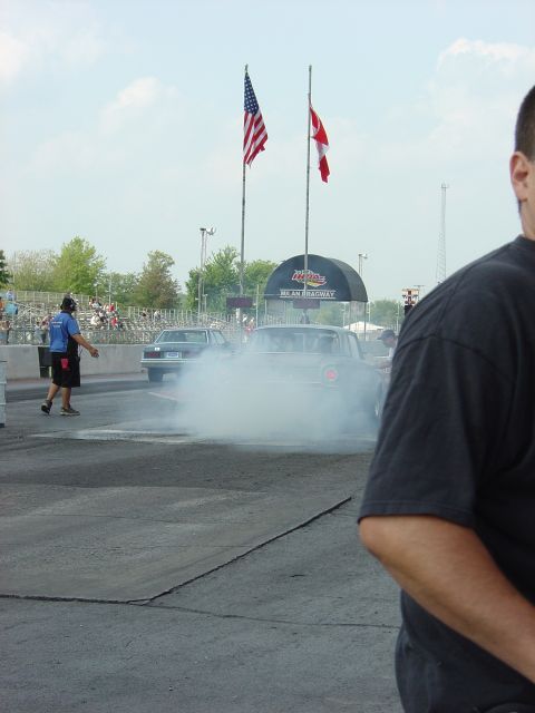 1960 Ford Falcon - A 1960 Ford Falcon performs a burnout at Milan Dragway, creating a large cloud of smoke.