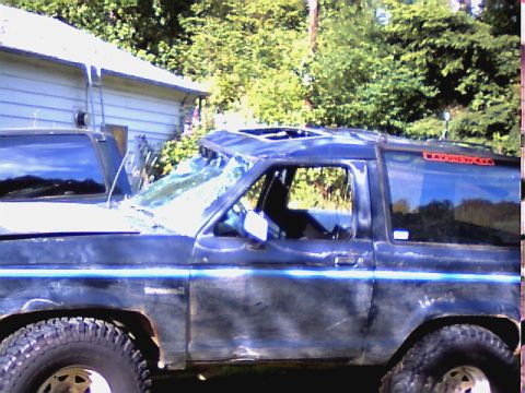1987 Ford Bronco II - This Ford Bronco II has sustained significant damage to its roof and windshield.