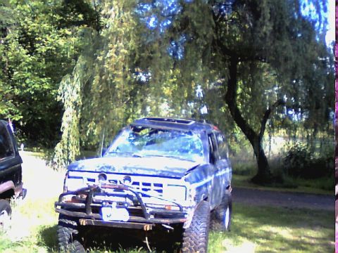 1987 Ford Bronco II - This SUV appears to be an older model, possibly from the 1980s, with a modified front bumper.