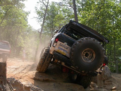 1990 Ford Bronco - You should have heard his kids scream when he slid sideways on this rock.