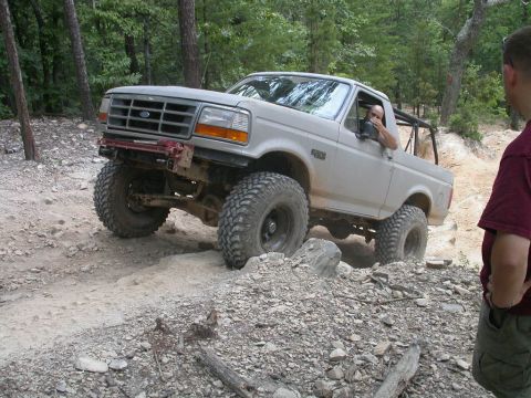 1990 Ford Bronco - This 1990 Ford Bronco navigates a challenging rocky terrain during an off-road excursion.