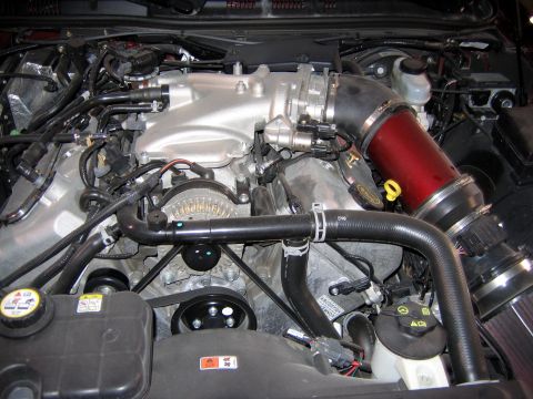 2000 Ford Crown Victoria - Close-up view of a modified engine bay, highlighting the intake system and engine components.