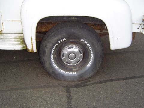 1972 Ford F-100 - Close-up of the front wheel and fender of a 1972 Ford F-100, showing BFGoodrich tires.