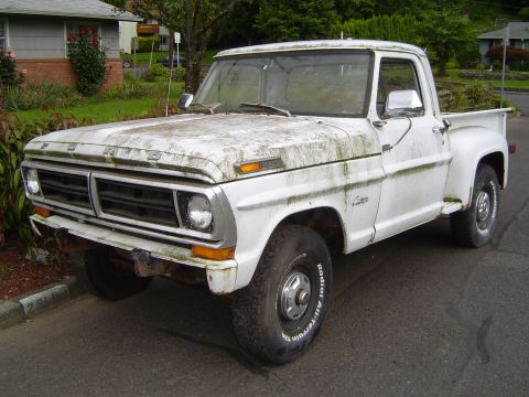 1972 Ford F-100 - This weathered 1972 Ford F-100 pickup truck displays its iconic grille and front end.