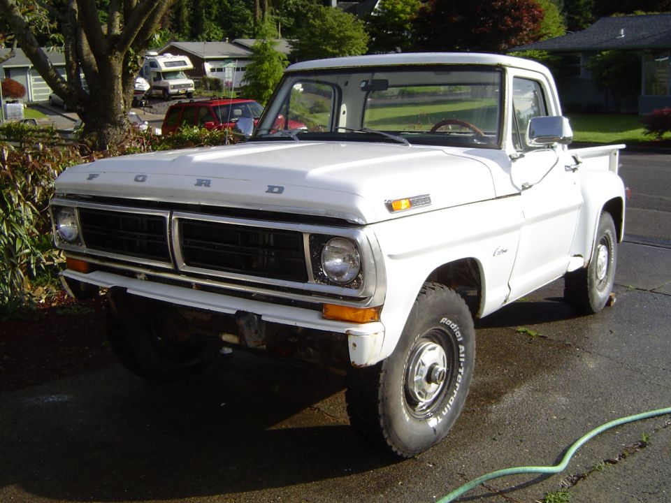 White 1972 Ford F-100 pickup truck, front 3/4 view