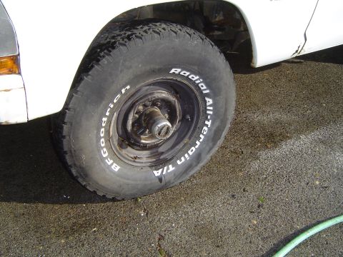 1972 Ford F-100 - A close-up view of a BFGoodrich Radial All-Terrain T/A tire mounted on a white truck.