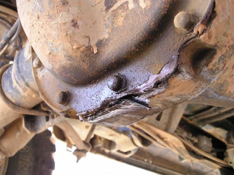 1996 Ford Bronco - Engine exhaust manifold detail, showing bolted connections and gasket.