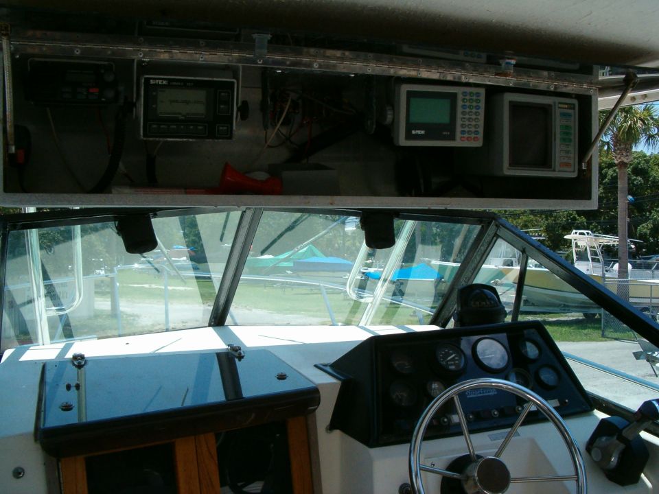 Inside an RV, looking forward past the dashboard and windshield
