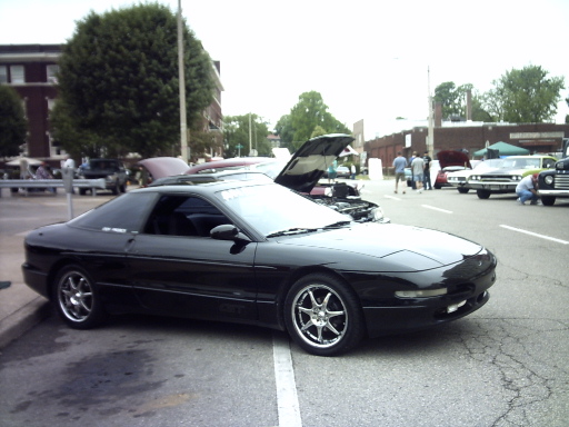 Black 1995 Ford Probe from the side