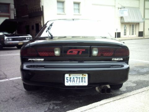 1995 Ford Probe - Rear view of a black Mazda Probe GT with dual exhaust pipes and Indiana license plate.