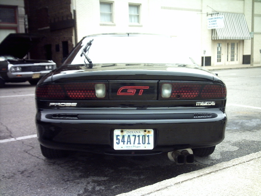 Black Mazda Probe GT with dual exhaust pipes and Indiana license plate 54A7101