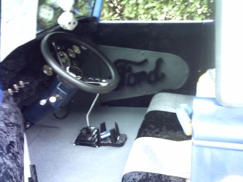 1995 Ford Probe - Custom hot rod interior features a vintage Ford logo and dice hanging from the mirror.