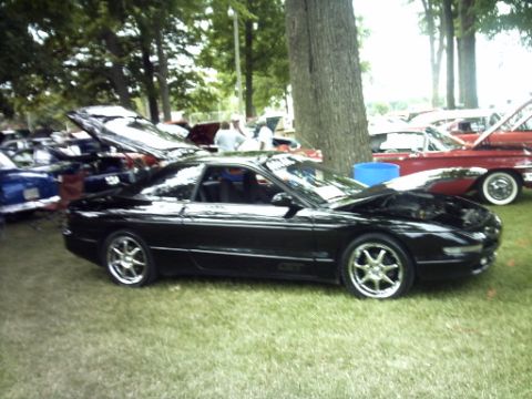 1995 Ford Probe - Black 1995 Ford Probe on display at an outdoor car show.