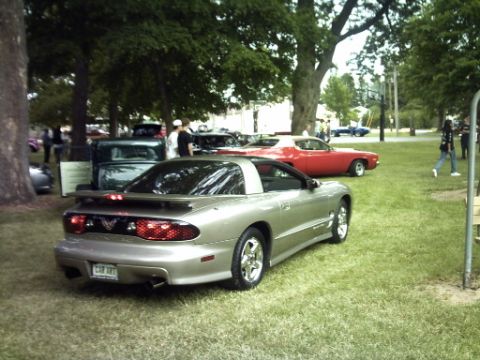 1995 Ford Probe - Rear view of a silver Pontiac Firebird at an outdoor car gathering.