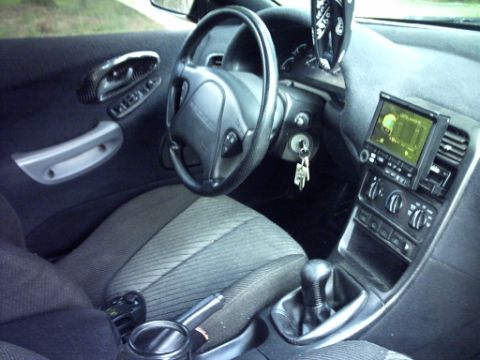 1995 Ford Probe - Interior view of a 1995 Ford Probe, showing the dashboard, steering wheel, and seats.