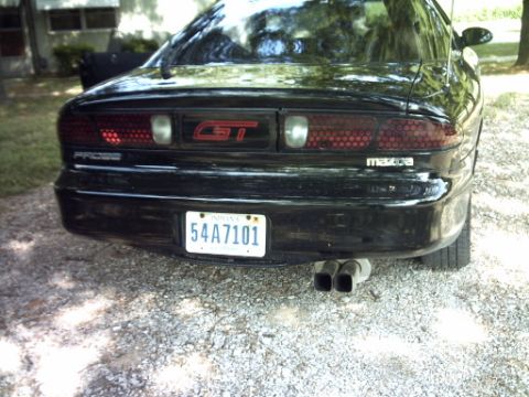 1995 Ford Probe - Rear view of a 1995 Ford Probe GT, showing its distinctive honeycomb taillights and dual exhaust pipes.