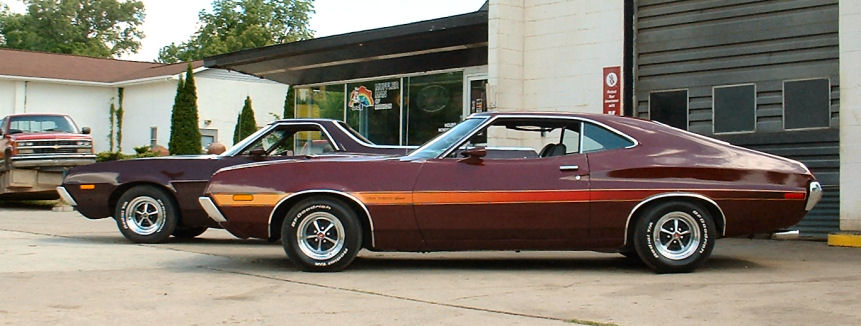 Maroon 1972 Ford Torino coupe, side view, with another Torino behind it