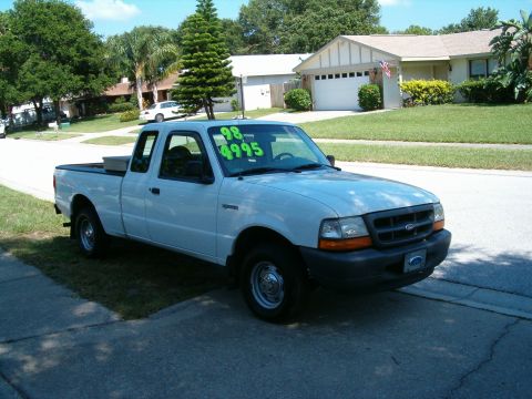 1991 Ford Bronco - A white Ford Ranger pickup truck is parked on the side of a residential street, with a price tag on the windshield.