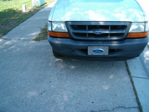 1991 Ford Bronco - Front view of a Ford Ranger, likely from the late 1990s, parked on a driveway.