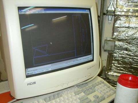 1995 Ford Bronco - CAD software displays a bumper design on a computer monitor, with a keyboard and a container in the foreground.