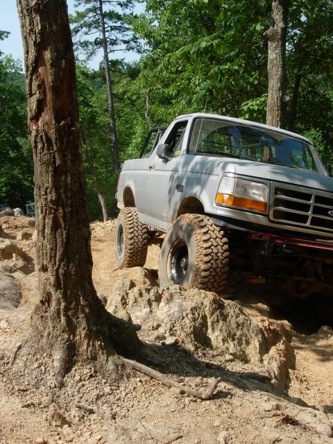 1995 Ford Bronco - This 1995 Ford Bronco navigates a challenging rocky terrain on an off-road trail.