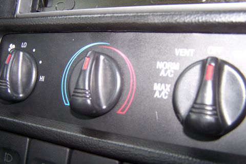 1997 Ford Probe - Close-up of the climate control knobs and settings inside a vehicle.