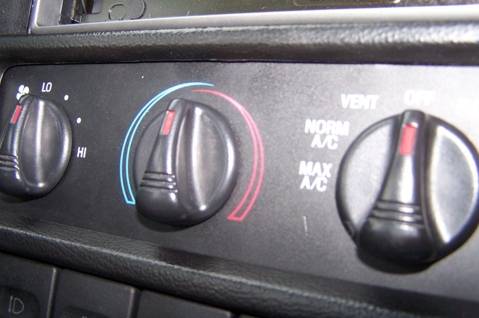 Interior climate control knobs with labels for LO, HI, NORM A/C, MAX A/C, VENT, and OFF
