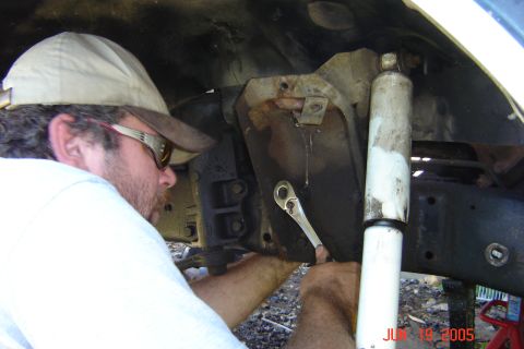 1979 Ford Bronco - Mechanic performs maintenance on vehicle suspension system, date stamped June 19, 2005.