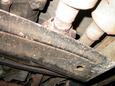 1990 Ford Bronco - Rocks have altered the genetic make up of this t-case skid plate