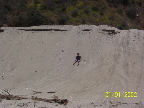 1985 Ford Bronco - son playing on sand hill.