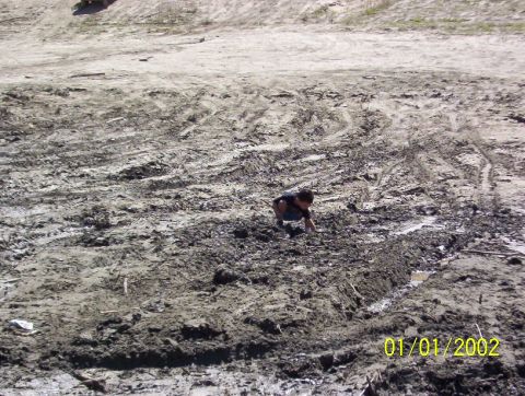 1985 Ford Bronco - son playing in mud pit before to many trucks arrive.