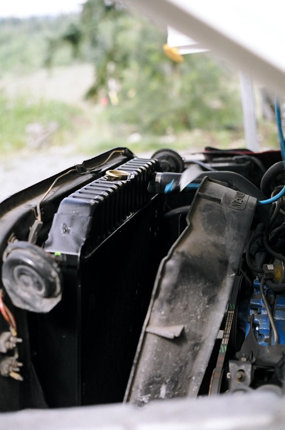 Radiator and engine bay components, including fan shroud and belts