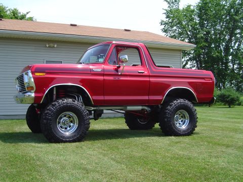1978 Ford Bronco - This lifted 1978 Ford Bronco is painted red and sits on large off-road tires.