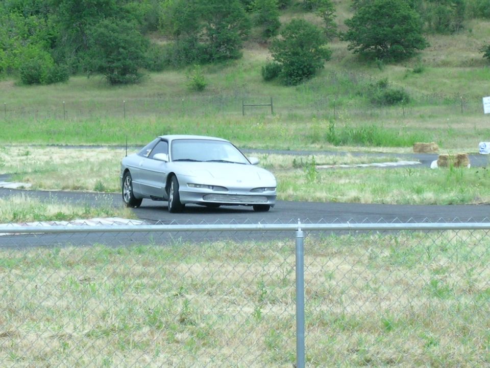 1993 Ford Probe on a race track, front 3/4 view