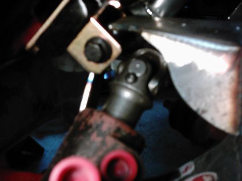 1978 Ford Bronco - Close-up view of a vehicle's driveshaft universal joint, showing mechanical components.
