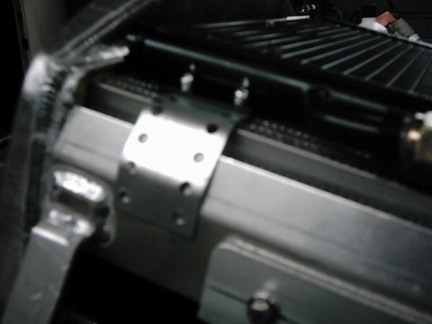1978 Ford Bronco - Radiator part with visible mounting hardware and Supermotors.net branding.