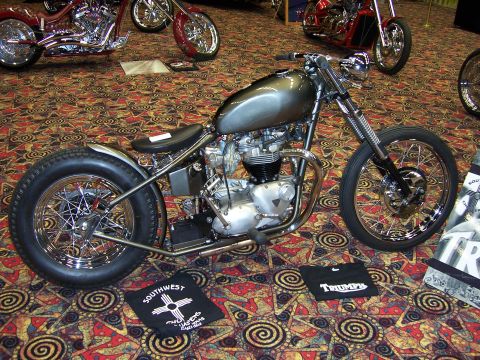1999 Jeep TJ - Custom motorcycle on display with other bikes in the background.
