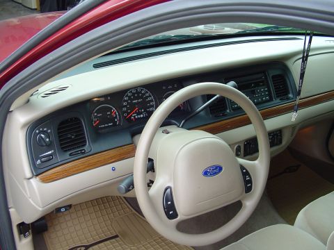 2004 Ford Crown Victoria - Dashboard and steering wheel of a Ford Crown Victoria, model year appears to be around 2003.