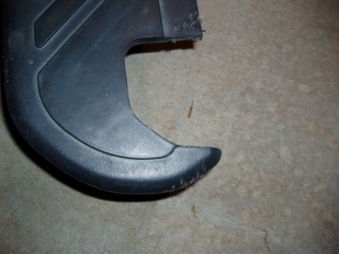 1994 Ford Bronco - Close-up of a black plastic trim piece, possibly from a vehicle interior or exterior.