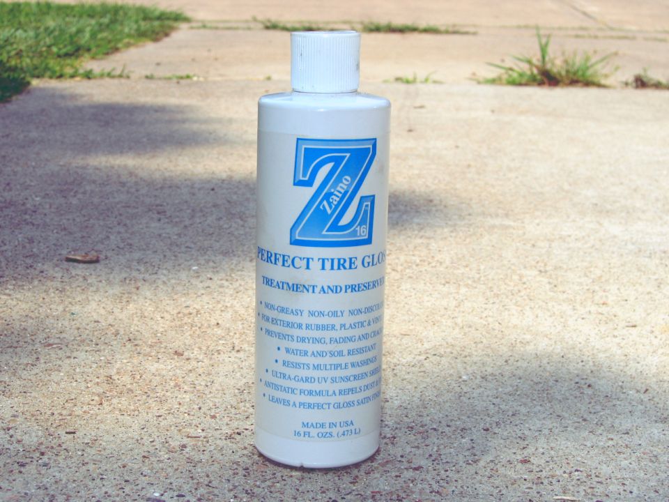 Bottle of Zaino Perfect Tire Gloss on concrete
