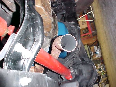 1983 Ford Bronco - Close-up view of a vehicle's undercarriage, focusing on exhaust and suspension components.