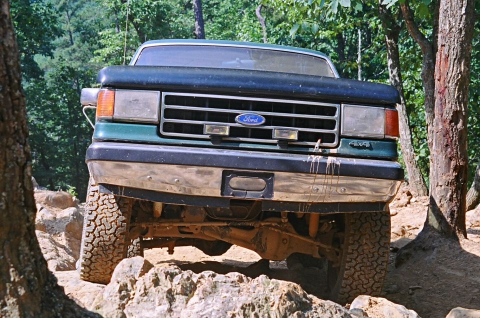1990 Ford Bronco front view on rocky terrain