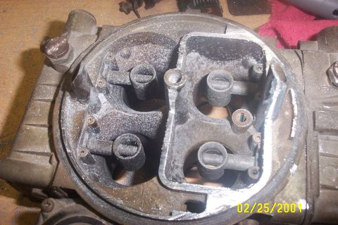 1979 Ford F-150 - A close-up view of a carburetor, revealing its internal structure and signs of wear.