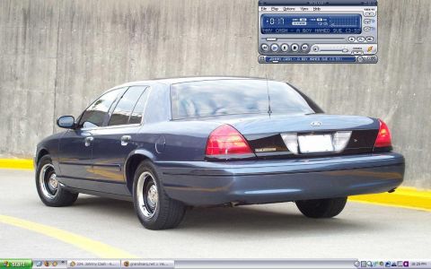 2000 Ford Crown Victoria - Rear view of a dark blue 2000 Ford Crown Victoria sedan parked outdoors.