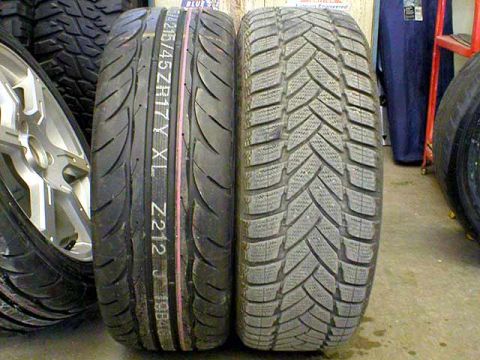 2004 Ford Focus - A comparison of two different tire treads is displayed, highlighting their distinct patterns.