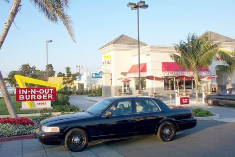 2003 Ford Crown Victoria - A black 2003 Ford Crown Victoria is seen parked in front of an In-N-Out Burger restaurant.