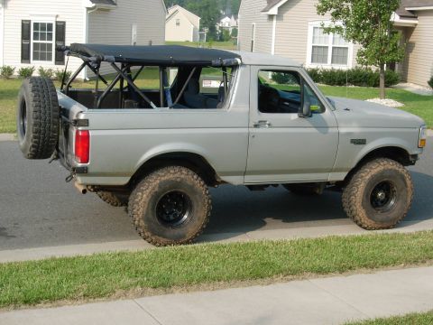 1995 Ford Bronco - This 1995 Ford Bronco features a removable soft top and is equipped for off-road use with lifted suspension and large tires.